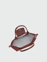 Bolso tote Longchamp modelo Le Pliage One en tamaño mediano, color bordó, con diseño minimalista, cierre superior y doble asa de mano.