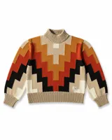 Buzo de tejido de punto con cuello alto y diseño geométrico en zigzag. Presenta una combinación de colores cálidos como naranja, rojo, negro y beige, con puños y cintura acanalados.