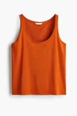 Musculosa cropped color naranja, de punto suave de algodón, con corte holgado, escote en U y bajo recto.