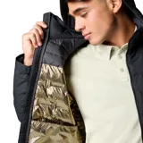 Campera técnica con capucha, color negro, con tecnología de aislamiento térmico y construcción sin costuras. Cuenta con cierre frontal, bolsillos laterales con cremallera, puños ajustables y dobladillo con cordón.