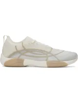 Championes de entrenamiento Under Armour W Sculpt TR para mujer, color beige y blanco, con detalles de líneas abstractas en el lateral y suela de goma.