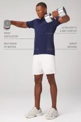 Remera deportiva de alto rendimiento Fabletics, confeccionada en tejido seamless ultraligero y transpirable con paneles de malla laterales para mayor ventilación. Presenta cuello redondo y mangas cortas, diseñada para entrenamientos intensos con propiedades antiolor y de absorción de sudor.