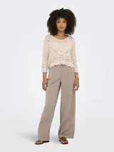 Pantalon sastrero de tiro alto color gris oscuro, de corte ancho y pinzas frontales.