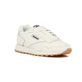 Championes Reebok Glide blancos con detalles en azul marino y suela color caramelo. Zapatillas de cuero con cordones y logo de la marca en el lateral y la lengüeta.