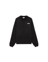 Buzo de algodón estilo polo con cuello camisero, manga larga y puños acanalados. Presenta el logo de la marca bordado en el pecho y un diseño de corte holgado.
