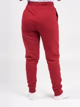 Pantalón babucha deportivo unisex azul, de tiro alto, con puños y cordones ajustables.