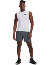 Musculosa térmica Under Armour HeatGear Armour Compression de color blanco, sin mangas y con diseño de compresión. Presenta cuello redondo y el logotipo de la marca estampado en negro en el pecho.