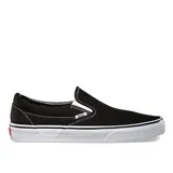 Championes Vans Classic Slip-On negros con suela blanca.