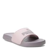 Sandalias tipo ojota Puma modelo Popcat 20, con base y suela en color lila y banda superior en color rosado con el logo de la marca en relieve.