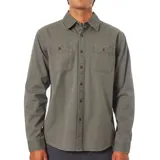 Camisa de manga larga confeccionada en lona de algodón con acabado desgastado. Presenta cuello clásico, cierre frontal con botones y dos bolsillos frontales con solapa.