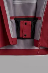 Cazadora deportiva de esquí con diseño bicolor en tonos negro y verde oliva. Presenta capucha amplia con visera, cierre frontal con cremallera termosellada, bolsillos frontales y en manga con cierres impermeables, y aberturas de ventilación en las axilas. Incluye faldón interior antinieve, puños ajustables y tecnología de rescate RECCO.