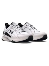 Championes de entrenamiento Under Armour modelo Charged Edge, color blanco con detalles en negro. Presentan parte superior de malla transpirable con revestimientos de cuero y material sintético, entresuela Charged Cushioning para amortiguación y suela de goma con tracción.