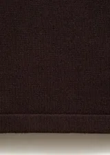 Pantalón wideleg de punto fino y tiro medio, con cintura elástica sin cierre, diseño largo y corte holgado.