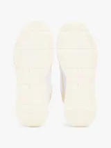 Zapatillas Tommy Hilfiger de mujer, color blanco con detalles en amarillo y verde. Presentan el logo de la marca en el lateral y están confeccionadas con una mezcla de texturas.