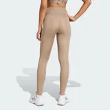 Calza deportiva de entrenamiento Adidas Optimé Essentials, color tostado de tiro alto con tecnología AEROREADY. Cuenta con cintura que se mantiene firme y costuras selladas.