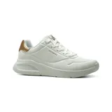 Championes Skechers Uno Lite Shimmer Along, color blanco con detalles metalizados en tono oro rosado en el talón. Presentan capellada de durabuck sintético con perforaciones decorativas, plataforma ligera y cordones tono sobre tono.