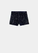 Short de tiro alto confeccionado en tejido de terciopelo con aplicación de lentejuelas brillantes. Presenta un diseño corto con cierre de cremallera lateral.