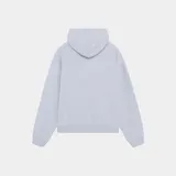 Campera con capucha de felpa gris melange, con cierre frontal de doble cremallera metálica, bolsillos tipo canguro y estampado frontal con el texto "Eme Studios Badge" en azul marino.