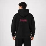 Canguro negro con capucha, diseño oversize, puños y dobladillo en ribete elástico. Cuenta con el texto 'Become.' bordado en color fucsia en la parte posterior.
