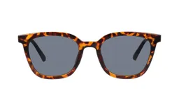 Lentes de sol con armazón de acetato en estampado carey y cristales oscuros de forma redondeada.