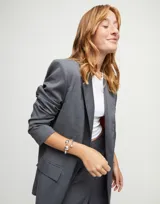 Pulsera rígida plateada con tres bolas en aleación de metales bañadas en plata de ley.