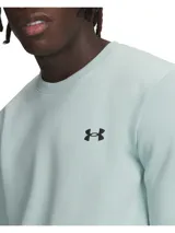 Buzo de cuello redondo Under Armour, confeccionado en tejido de doble punto elástico y transpirable. Presenta un diseño minimalista con el logo de la marca en el pecho y puños acanalados.