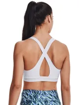 Top deportivo Under Armour Crossback Mid Bra, color blanco, de diseño liso con tirantes cruzados en la espalda y banda elástica inferior con el logotipo de la marca. Confeccionado en tejido HeatGear de doble capa con copas suaves y extraíbles.