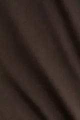 Leggings de tejido de punto suave color marrón oscuro, con cintura ancha y pierna acampanada.