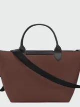 Cartera de mano Longchamp modelo Le Pliage Energy tamaño S, confeccionada en lona de color bordó con detalles en cuero negro. Cuenta con doble asa superior, correa de hombro ajustable y extraíble, cierre principal con cremallera y solapa frontal con broche a presión.