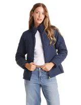 Campera capitoneada azul marino con diseño de rombos y paneles laterales elásticos para un ajuste entallado. Presenta cuello alto, cierre frontal completo y bolsillos laterales con cierre.