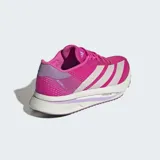 Championes de running Adidas Adizero SL2, color fucsia vibrante con tres franjas laterales plateadas. Presentan una mediasuela gruesa blanca con detalles en lila y la inscripción "LIGHTSTRIKE PRO".