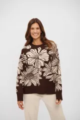 Buzo de tejido de punto con diseño floral en contraste, cuello redondo y mangas largas.