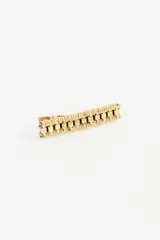 Hebilla para el pelo de estilo étnico, confeccionada en metal plateado con diseño texturizado y eslabones decorativos.