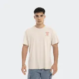 Remera color beige de corte oversize, con logo de Reef estampado en el pecho.