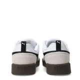 Championes urbanos Puma modelo Park Lifestyle OG, color blanco con detalles en negro y suela marrón. Presentan puntera reforzada en gamuza y el logo característico de la marca en el lateral.