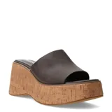 Sandalias Miss Carol modelo Bruma, estilo slide con plataforma y taco chino de corcho. Capellada ancha de color marrón oscuro confeccionada en material sintético.