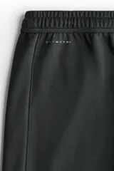 Jogger deportivo H&M de corte relajado, color negro, confeccionado en tejido funcional con tecnología DryMove. Cuenta con cintura elástica con cordón de ajuste, bolsillos laterales y diseño de piernas rectas.
