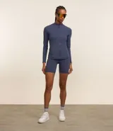 Campera deportiva Get Over de cuello alto, con cierre frontal por cremallera y bolsillos laterales. Confeccionada en tejido técnico de poliamida y elastano, ideal para actividades físicas.