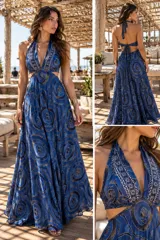 Vestido largo de seda color azul con estampado circular, escote halter pronunciado y aberturas laterales en la cintura.