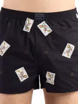 Bóxer de algodón blanco con estampado de flores pequeñas color celeste, con cintura elástica y logo de la marca en el centro.