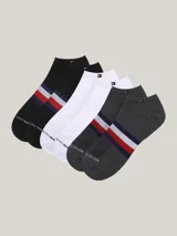 Pack de tres pares de medias tobilleras Tommy Hilfiger en colores negro, blanco y gris. Cada par presenta una banda horizontal con los colores rojo, blanco y azul característicos de la marca.