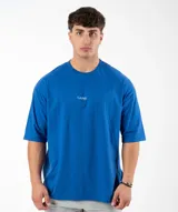 Remera negra de algodón, corte oversize, con inscripción 'GAINS.' en el frente.