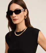 Blusa de manga corta, cuello redondo y corte ajustado, confeccionada en tejido rib de algodón.