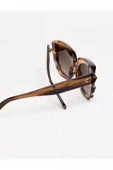 Lentes de sol Tiwi modelo Matisse, con armazón carey de acetato y lentes degradadas marrones.
