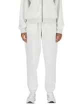 Pantalon de jogging New Balance French Terry, color gris melange, de corte relajado con cintura elástica y puños en los tobillos.