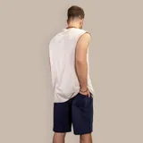 Musculosa beige de algodón con efecto acid wash y corte holgado.