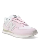 Championes urbanos New Balance modelo 574, color rosado con detalles en blanco y beige. Confeccionados en gamuza y malla, presentan el logo N característico en los laterales y entresuela con tecnología ENCAP para mayor soporte y estabilidad.