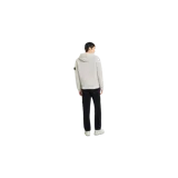 Pantalón chino de pana Stone Island en color negro, de corte tapered, con bolsillos laterales y el parche distintivo de la marca en el lateral.