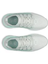 Championes Under Armour modelo Phantom X, de diseño futurista en color blanco con detalles en verde agua. Presentan una parte superior de tejido transpirable, estructura de TPU en el mediopié para soporte y entresuela con amortiguación de espuma reactiva.
