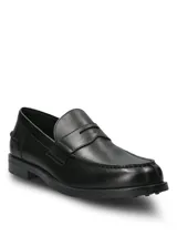 Mocasines Hush Puppies modelo Lucanos, de cuero color negro, con diseño clásico de antifaz y suela de goma.